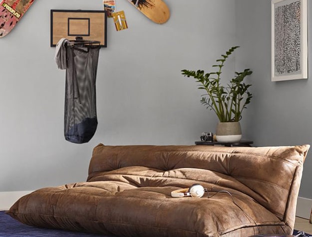 teen boy’s bedroom with basketball laundry hoop