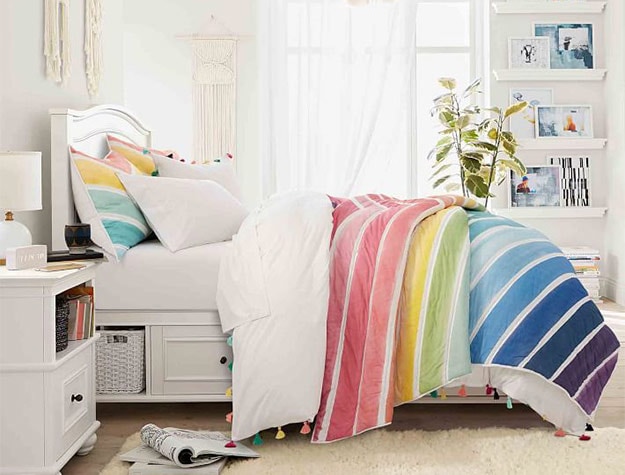 bed with rainbow comforter