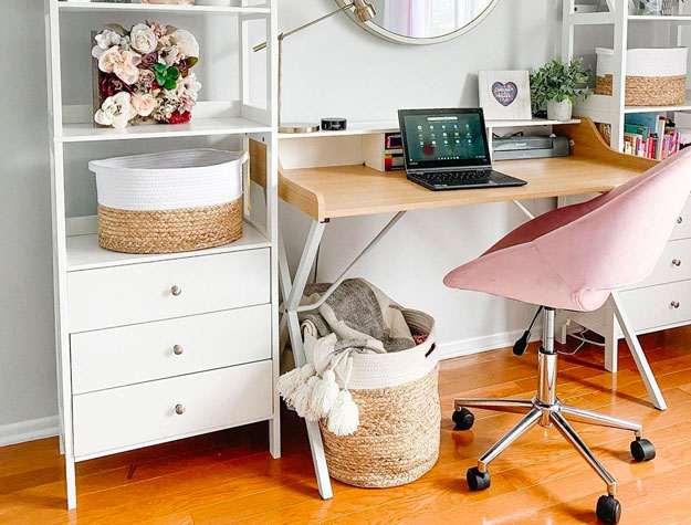 pink swivel chair and white desk