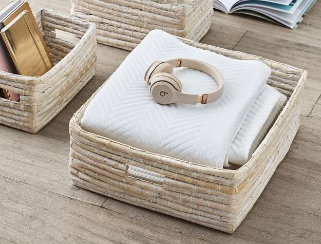 Woven basket with blanket and headphones