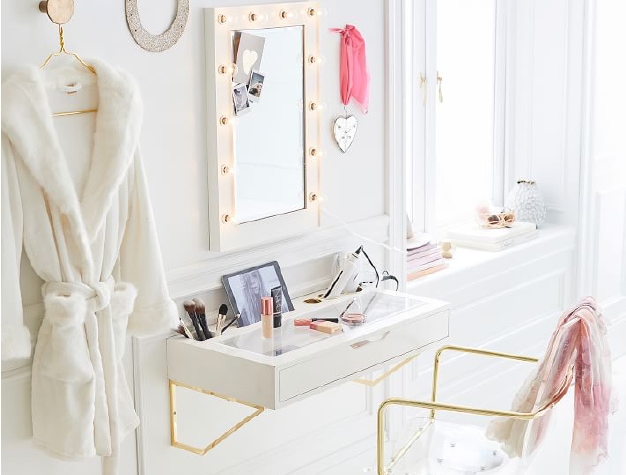 White vanity with gold hardware