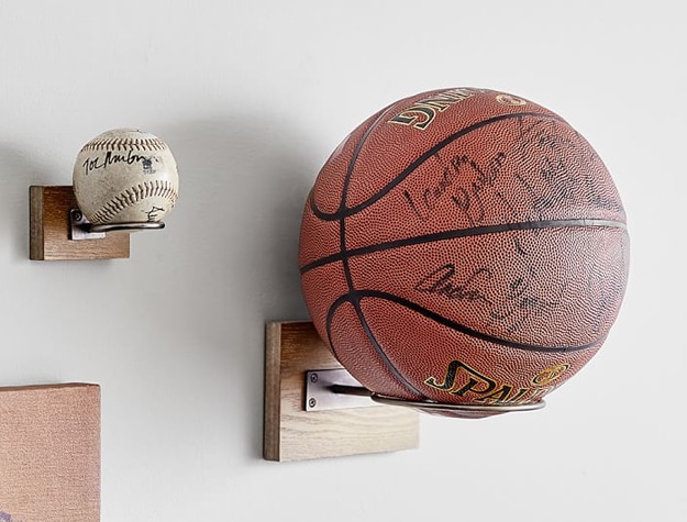 Wooden ball mounts holding signed baseball and basketball