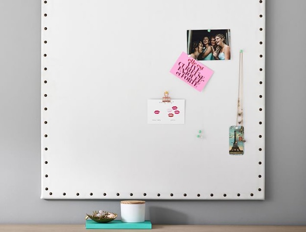 White pinboard with studs around edges
