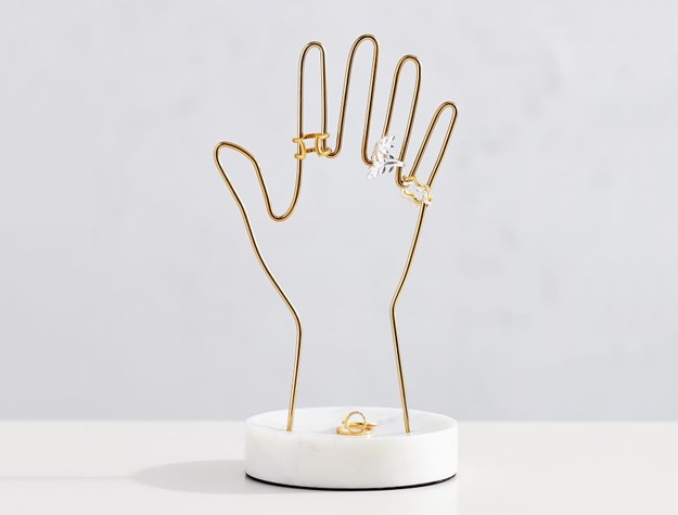 Marble and gold hand-shaped jewelry display stand