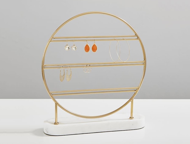 Round gold and marble earring holder stand