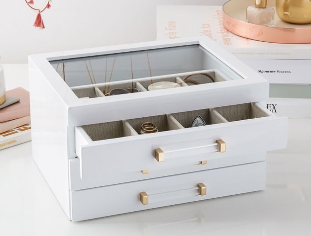 White jewelry display box with drawers and glass top