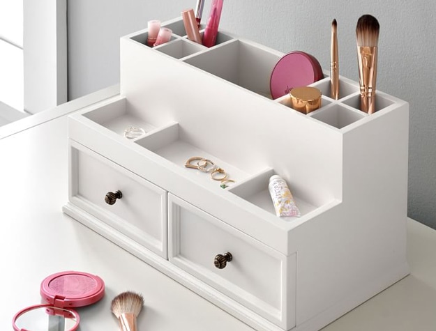 White jewelry holder and makeup organizer on table