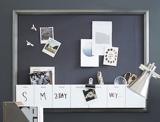 Pinboard with dry erase calendar cubby.