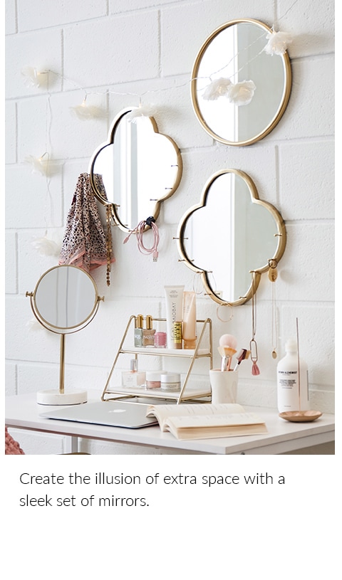 Create the illusion of extra space with a sleek set of mirrors.