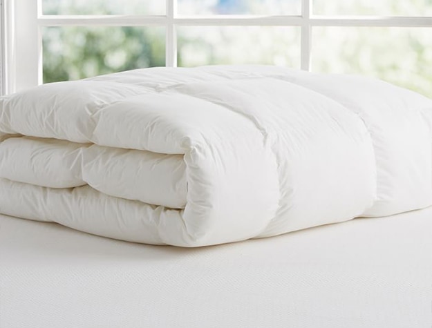 White duvet insert on a mattress.