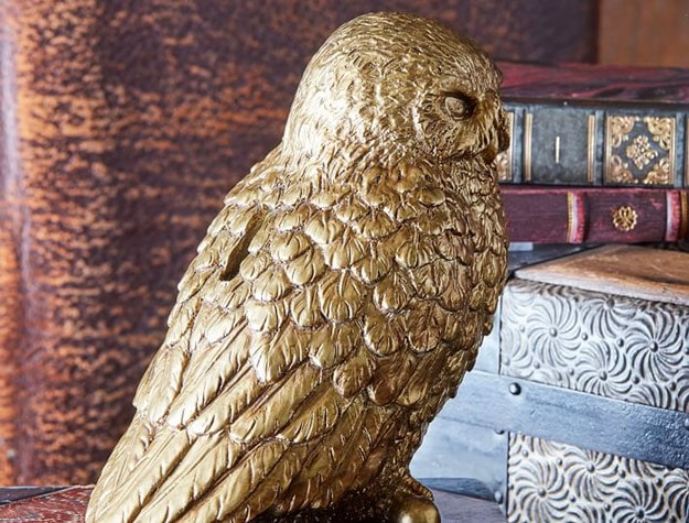 Harry Potter™ Hedwig™ piggy bank on stack of books