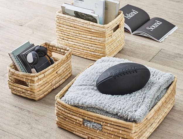 Naturalist woven storage bins with items inside