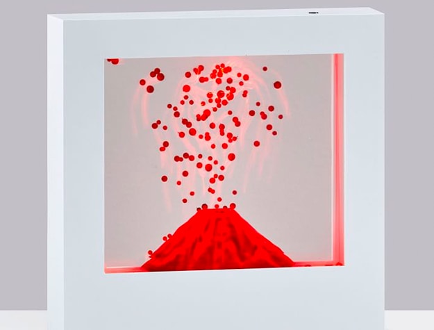 Volcano Light Box with red volcano scene in a white frame.