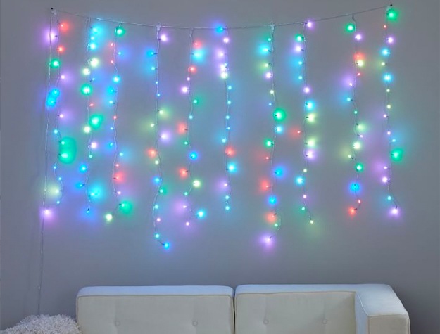 Color Changing Waterfall String Lights hanging above a white couch.