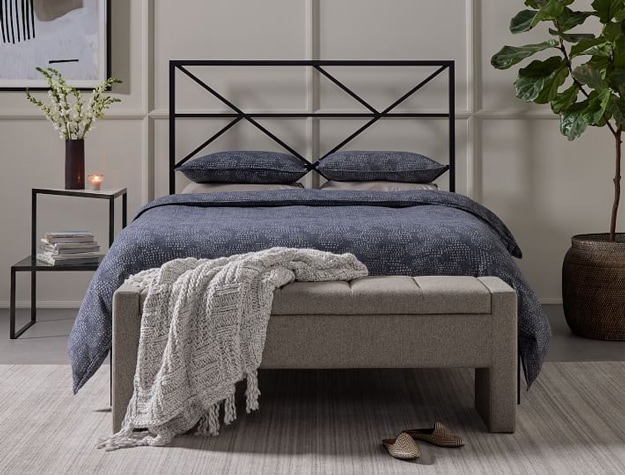 Cato bed with a unique horizontal-patterned headboard styled in a neutral colored bedroom.