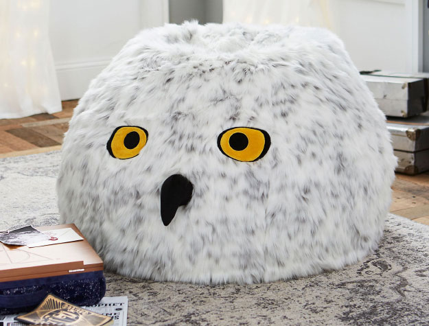 A Hedwig bean bag chair sitting in a bedroom.
