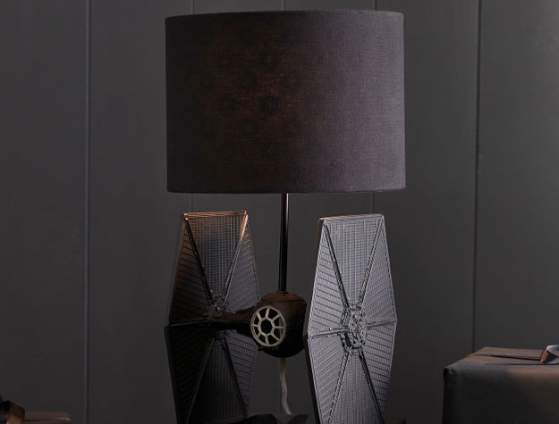 A black Star Wars™ TIE Fighter™ lamp sitting on a desk.