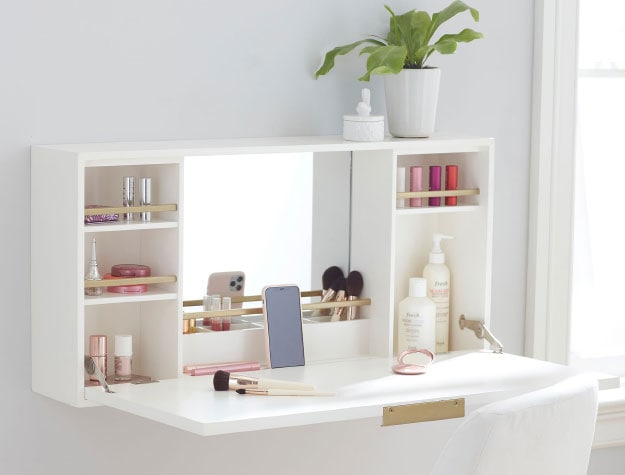 White beauty station with makeup inside.