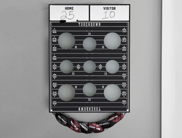 A wall-mounted football bean bag toss game.