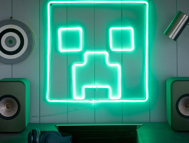 A green Minecraft™ LED wall light.