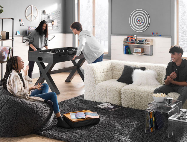 Teens hanging out in a stylish room.