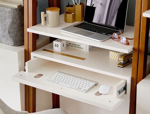 West elm x pbt modern adjustable wall desk with office supplies.