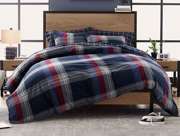 Walker Plaid Duvet Cover in red styled with a light-colored wood bed frame and matching nightstands.