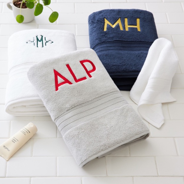Stack of quick dry bath towels in neutral color available with monogrammed options.