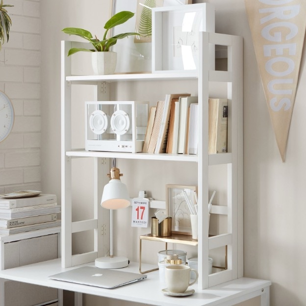 A white desk hutch sitting on top of a desk