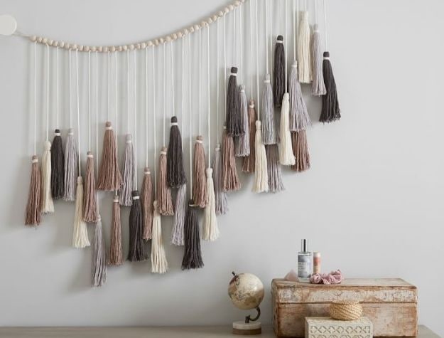 neutral tassel garland hanging on wall