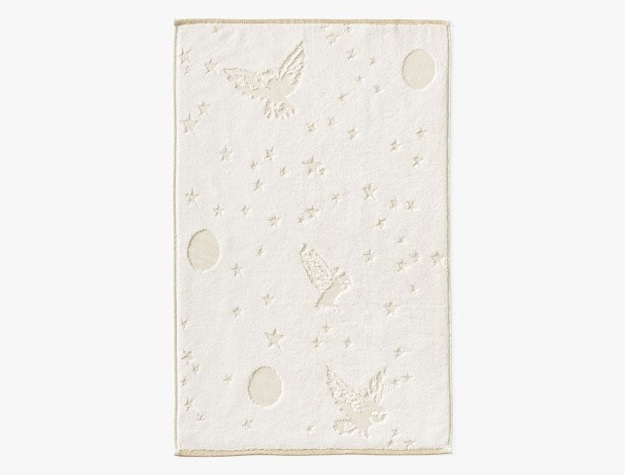 This cotton-terry towel is oh-so-soft and features an enchanting pattern of owls, moons, and stars.