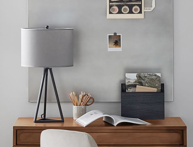 Galvanized magnet board above desk.