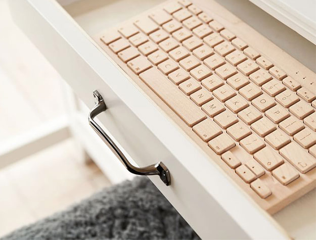 wooden keyboard in desk drawer