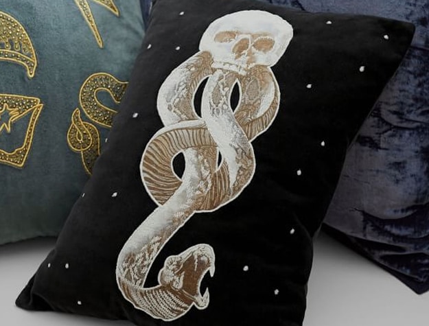 A black decorative pillow cover features the Dark Mark from the Harry Potter series.