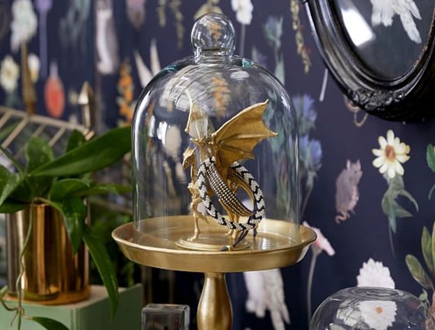 A golden jewelry cloche features a Thestral from the magical world of Harry Potter.