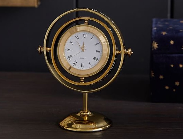 A clock inspired by Harry Potter’s Time-Turner sits on a desk.