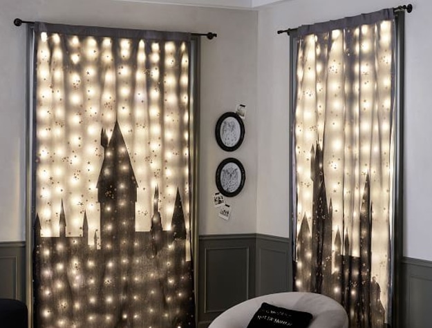 Black-out curtains featuring the Hogwarts castle add a little magic to this room.
