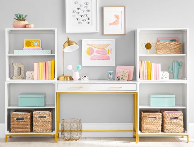 white bookshelf with gold and pastel accents