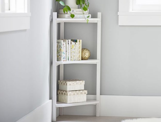 white corner shelf with books