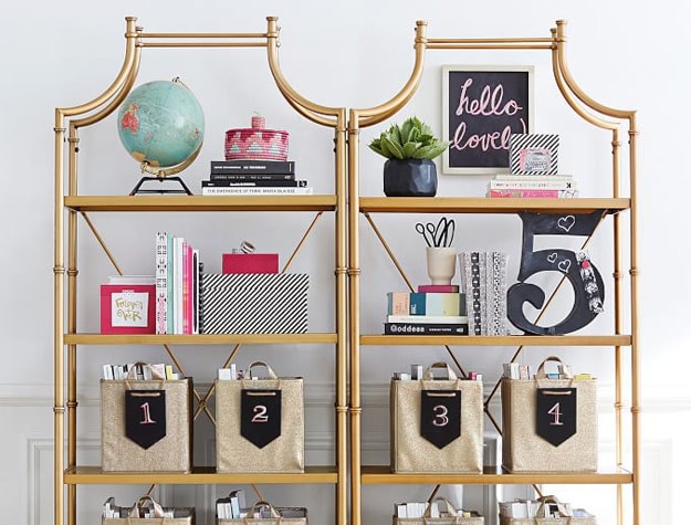 gold shelving with pink accents