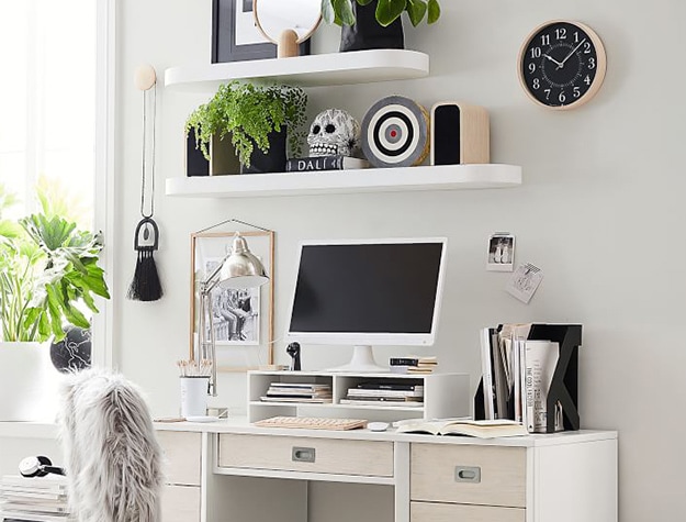 white desk with white wall shelves