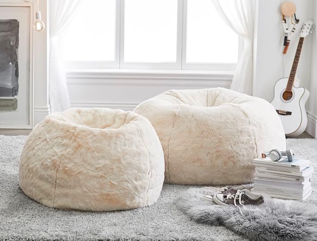 Two white bean bag chairs