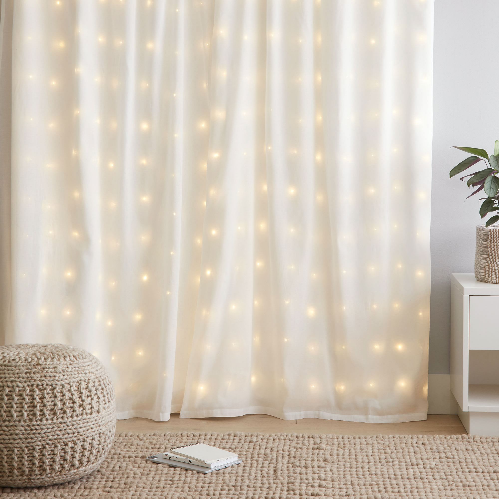 A Fairy Light wall curtain in a bedroom in daylight
