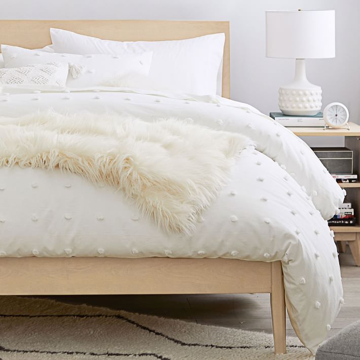 white tufted dot comforter