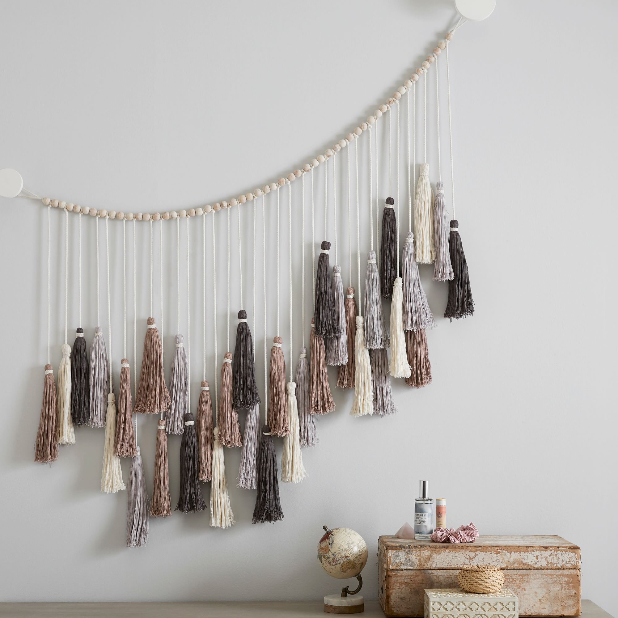 large tassle garland from pottery barn, gallery wall fillers