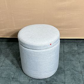Open Box: Simple Round Storage Ottoman - Eco-Performance Texture Weave Chambray