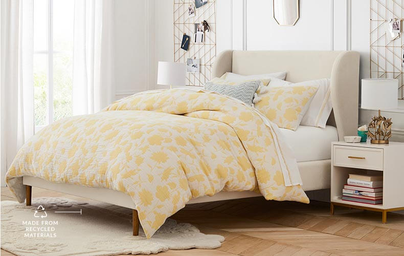 Bedroom with a yellow floral duvet cover