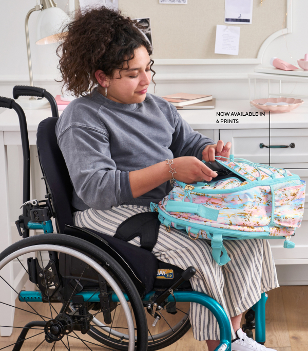 GIF playing of four different photos. The first photo shows a teenage girl sitting in her wheelchair next to a desk at her bedroom. She's reaching into the pocket of her Pottery Barn Teen Gear-Up Adaptive Backpack in Artsy print.