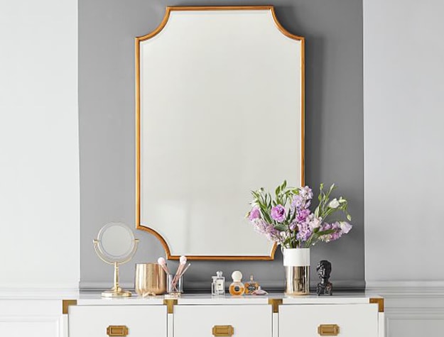 gold mirror above dresser