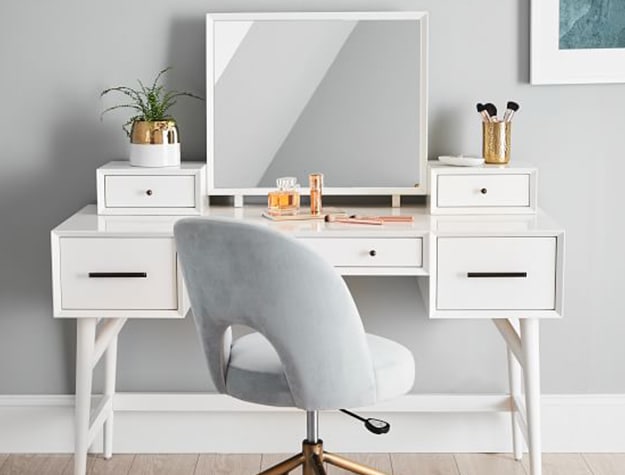 grey chair in front of vanity